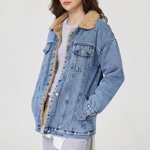 Detailed view of women's oversized denim jacket with warm sherpa fleece lining