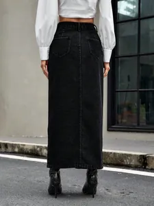 Detailed back view of a vintage high-waisted black denim maxi skirt with back pockets