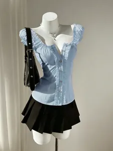 Light blue sweet style puff-sleeve shirt with ruffle details on a white mannequin