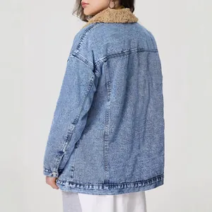 Back view detail of women's oversized denim jacket featuring a plush tan fleece collar