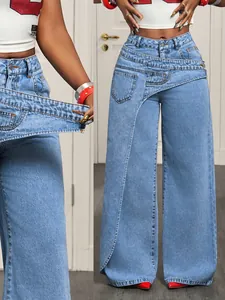 Detail of blue wide-leg jeans featuring a trendy asymmetrical double waist design