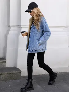 Stylish women's oversized denim jacket with cozy sherpa lining for winter outdoor fashion