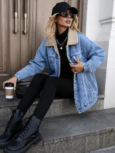 Detailed view of women's oversized sherpa lined denim jacket in light blue wash