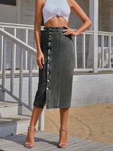 Close-up detail of high-waisted denim midi skirt with front buttons and stylish slit