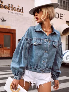 Stylish urban oversized cropped blue denim jacket with fashionable puff sleeves
