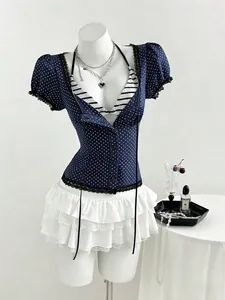 Slim fit dark blue polka dot short sleeve shirt paired with white ruffled lace mini skirt