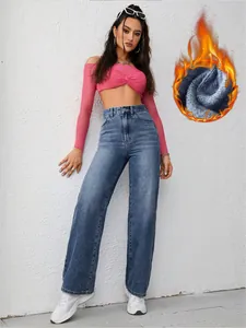Detail view of high-waisted wide-leg jeans featuring a warm fleece lining for winter