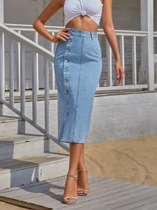 Fashionable high-waisted light blue denim midi skirt with stylish side buttons.