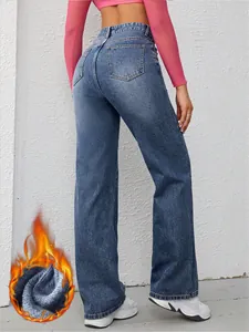Detailed view of women's wide-leg jeans with warm fleece lining for winter