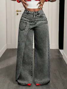 Detailed view of women's trendy gray denim jeans featuring asymmetrical crossover waist
