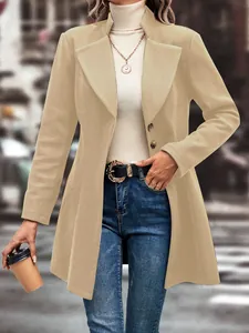 Detailed view of women's beige woolen coat with lapel collar in urban street setting