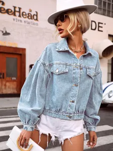 Street style side view of light blue cropped denim jacket featuring trendy puff sleeves