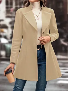 Detail of an elegant tan wool-like coat with lapel collar for autumn and winter fashion.