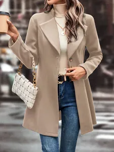 Chic khaki lapel wool coat paired with an ivory turtleneck and woven handbag