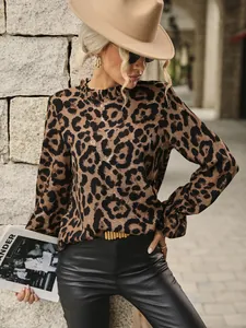 Detail showing leopard print blouse with ruffle collar and slim fit long sleeves.