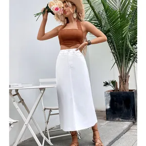 Detailed shot showing the white high-waist denim midi skirt with a stylish raw hem finish