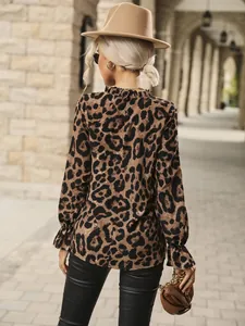 Back view of stylish leopard print long-sleeved shirt featuring a chic ruffle collar