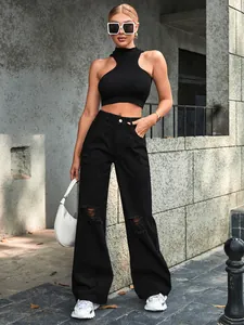 Chic urban style featuring black distressed wide-leg jeans and a sleek sleeveless crop top.