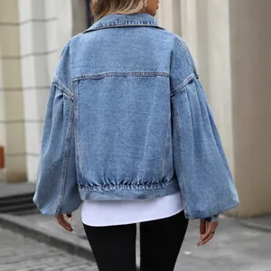 Trendy womens oversized light blue wash denim jacket featuring puff sleeves and short fit back view