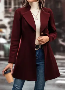 Detail shot of an elegant wine red wool coat with a classic notched lapel design.
