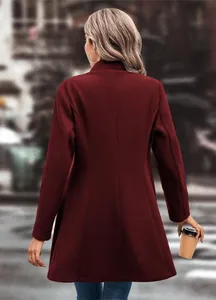 Detailed back view of a long burgundy wool coat showing elegant slim fit and silhouette