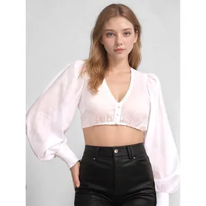 Elegant white lantern sleeve V-neck crop top blouse detail for Octoberfest outfits