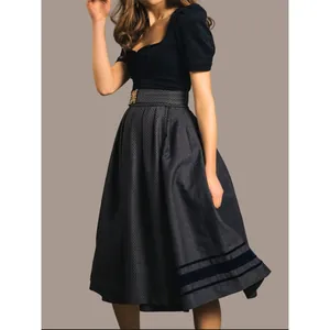Elegant German Oktoberfest dirndl dress with velvet details and patterned midi skirt