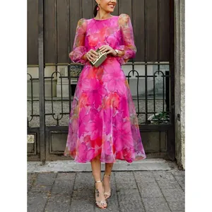 Detail view of pink floral mesh midi dress with elegant puff sleeves and vibrant prints