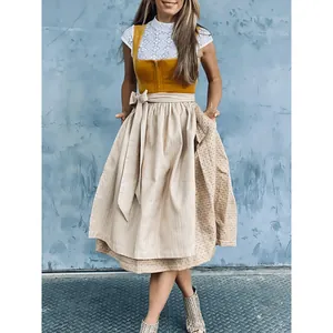 Full view of elegant German Oktoberfest Dirndl dress with lace blouse and apron