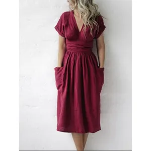 Detailed view of a maroon cotton linen casual dress featuring V-neck and pockets