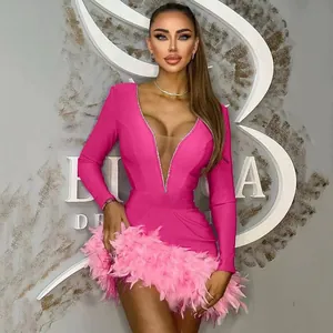 Deep V-neck pink bandage dress with feather hem and rhinestone trim details