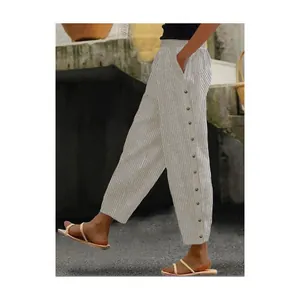 Side view of striped casual trousers with decorative buttons and elastic waist