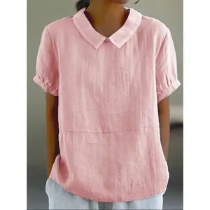 Vista dettagliata della blusa in cotone e lino rosa con colletto Peter Pan e maniche a sbuffo