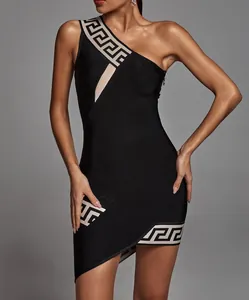 Close-up of black one-shoulder bandage dress with beige Greek key pattern detail