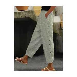 Detailed side view of women's grey vertical striped casual pants featuring button accents.