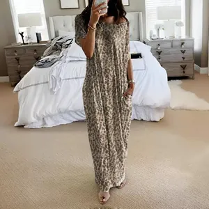 Elegant leopard print short sleeve maxi dress with pockets for summer casual wear.