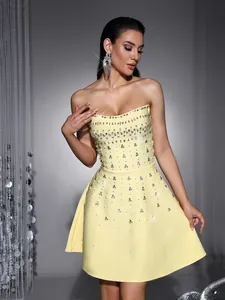 Close-up of yellow heavy beaded rhinestone strapless bandage evening party dress