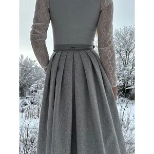 Back view of elegant gray German Dirndl dress with lace sleeves and jacquard skirt