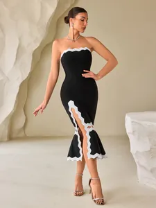 Elegante abito midi bandage a fascia nero con finiture smerlate bianche e orlo a sirena