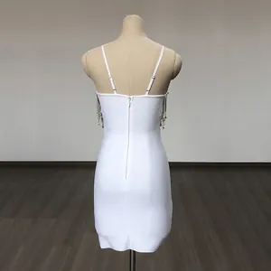 Back view showing rear detail of white bodycon bandage mini dress with sparkly rhinestone fringe