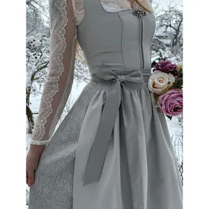 Elegant grey dirndl dress for Oktoberfest with lace sleeves and bow waist detail.