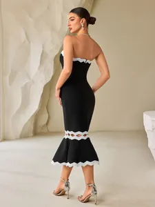 Elegante abito bandage nero con bordo smerlato bianco e dettaglio orlo a sirena
