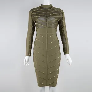 Close-up of olive green long sleeve bandage dress with gold rivets and mesh detail