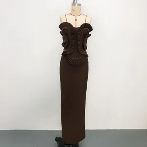 Detail showing the intricate ruffle design and handcrafted beads on a brown bandage dress