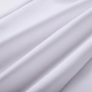 Detailed macro view of premium white stretch bandage fabric showing fine knit texture