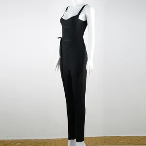 Detailed side view of a chic black V-neck bandage jumpsuit on a white mannequin.