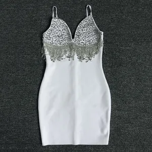 Elegant white bandage mini dress featuring intricate rhinestone tassels and sequin details.