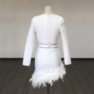 Back view of white long sleeve bandage mini dress with feather hem and rhinestone waist