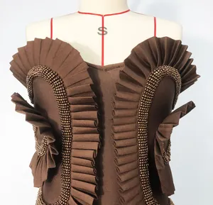 Detailed view of coffee brown bandage dress featuring ruffled edges and delicate beadwork