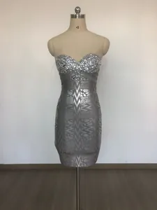 Macro view of silver strapless bandage mini dress with luxury rhinestone embellishments